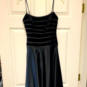 Black gown size 2 . Polyester (satin look) bottom with velvet top,
